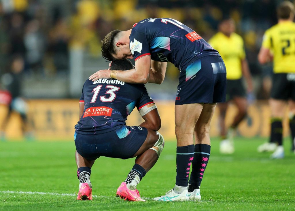 Filipo Daugunu and Lachie Anderson of the Rebels react after the final whistle in the Super Rugby Pacific Quarter Final match between Hurricanes and Melbourne Rebels at Sky Stadium, on June 08, 2024, in Wellington, New Zealand. (Photo by Hagen Hopkins/Getty Images)