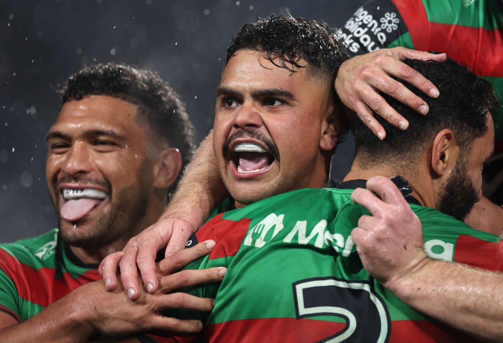 Latrell Mitchell of the Rabbitohs celebrates a try by team mate Alex Johnston of the Rabbitohs during the round 15 NRL match between South Sydney Rabbitohs and Brisbane Broncos at Accor Stadium, on June 14, 2024, in Sydney, Australia. (Photo by Cameron Spencer/Getty Images)